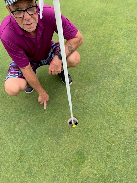 Fran's hole-in-one on #13 @ Crown Point GC... ball mark and the finger to prove it.